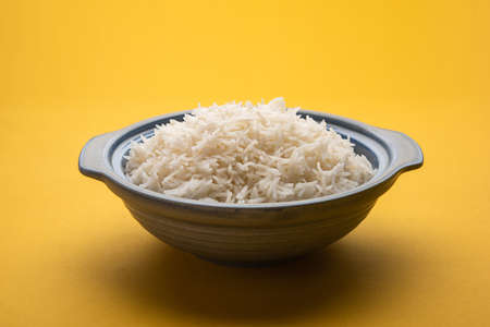 Aromatic Long Basmati cooked plain Rice is an Indian main course food, served in a bowl. selective focusの写真素材
