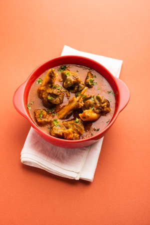 Indian style meat dish or Mutton OR Gosht Masala OR lamb rogan josh served in a bowl, selective...