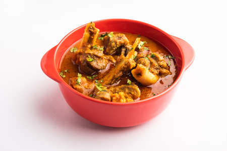 Indian style meat dish or Mutton OR Gosht Masala OR lamb rogan josh served in a bowl, selective...