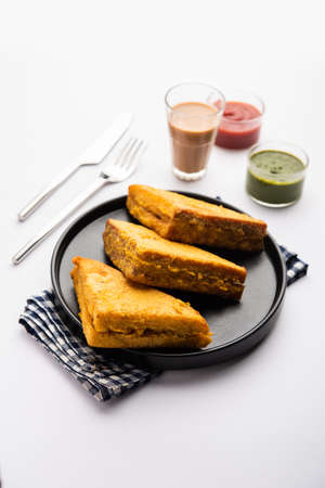 Sandwich Bread Pakora or triangle shape pakoda served with tomato ketchup, green chutney, Popular...