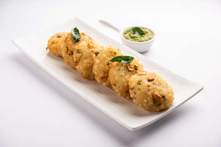 sabudana wada orÂ vada also known as Sago Fritters in india served with coconut chutney, Fasting...