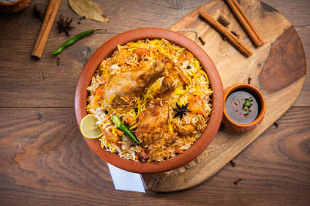 Dum Handi chicken Biryani is prepared in an earthen or clay pot called Haandi. Popular Indian non vegetarian foodの写真素材