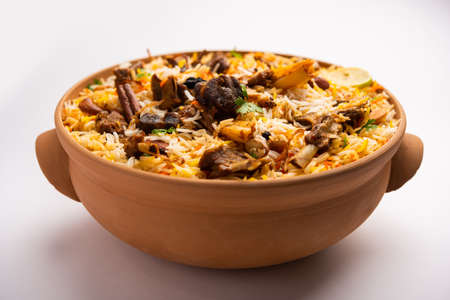 Dum Handi MuttonÂ BiryaniÂ or gosht pilaf is prepared in an earthen or clay pot called Haandi or 1 kilo size. Popular Indian non vegetarian foodの写真素材