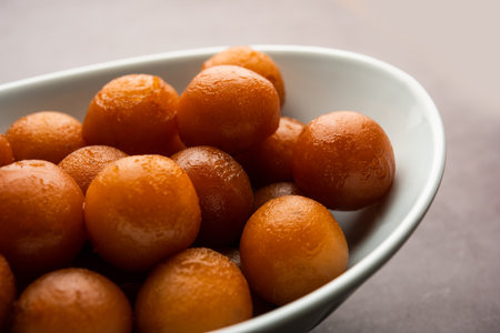 Gulab jamun is a milk-solid-based sweet dumpling popular in India, pakistanÂ in festivals like Diwali, eid or even wedding partiesの写真素材