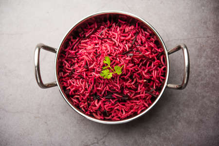 Beetroot Rice or pulao or pulav served in a bowl or karahi, selective focus. Indian foodの写真素材