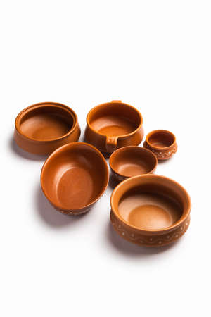 Collection of empty colorful ceramic bowls. Group of utensils captured from above, top view, flat...