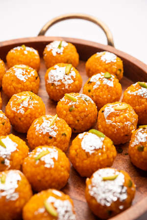indian sweet motichoor laddooÂ or Bundi laddu made of gram flour very small balls or boondis which are deep fried and soaked in sugar syrup before making ballsの写真素材