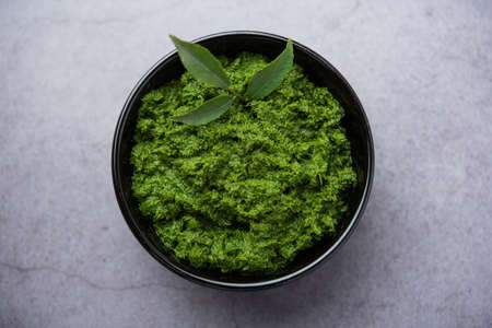 curry leaves or kadi patta chutney in a bowl