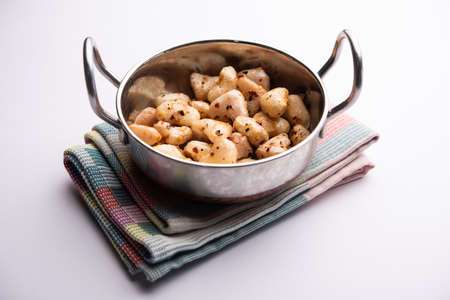 Stir fried water chestnuts recipe or Singhara or Singoda fryの写真素材