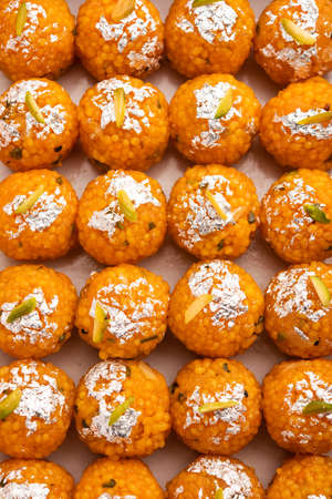 indian sweet motichoor laddooÂ or Bundi laddu made of gram flour very small balls or boondis which are deep fried and soaked in sugar syrup before making ballsの写真素材