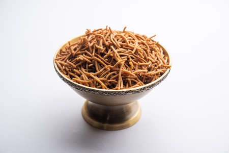 singada or singhara garlic sev, food made using water chestnut served in a bowlの写真素材