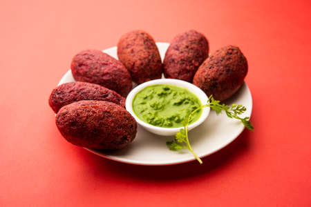 Beet Root Patties or cutlet or tikki served with green chutneyの写真素材