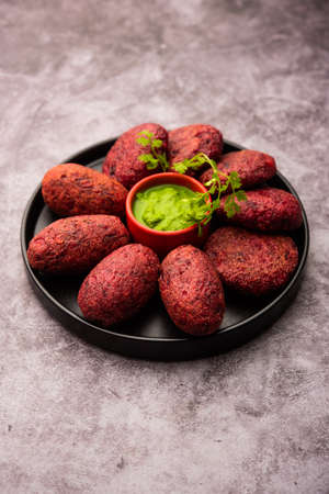 Beet Root Patties or cutlet or tikki served with green chutneyの写真素材