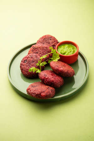 Beet Root Patties or cutlet or tikki served with green chutneyの写真素材