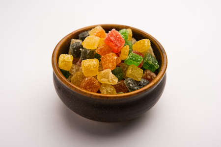 Indian colorful candy and jelly bites sweet, fruit flavoured confectionery coated with sugar, served in a plate or bowlの写真素材