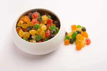 Indian colorful candy and jelly bites sweet, fruit flavoured confectionery coated with sugar, served in a plate or bowlの写真素材