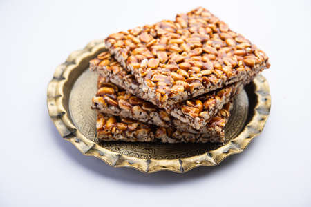 Peanut Jaggery chikki or bar using groundnut or shengdana with gur