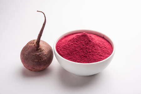 Heap of Beetroot or Beet Root powder with raw whole contains the essential minerals iron, potassium,...