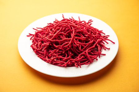 Beetroot sev or fried noodles is a colourful and healthy namkeen recipe from Indiaの写真素材