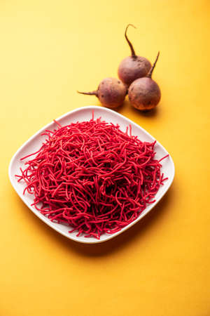 Beetroot sev or fried noodles is a colourful and healthy namkeen recipe from Indiaの写真素材