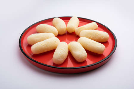 Cham cham is a Bengali sweet made by curdling milk and then shaping the coagulated solids to...
