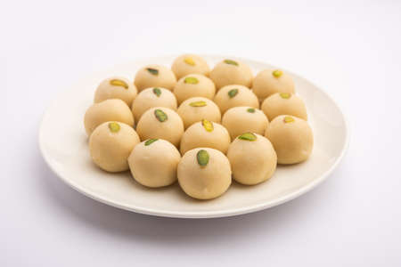 Malai Peda or white pera is a North Indian sweet Mithai or delight, prepared with full cream milk, sugar and cardamomの写真素材