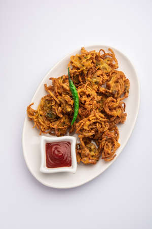 Crispy Kanda bhaji or Bhajji or Pyaj Pakode or fried onion pakora, delicious street food from Indiaの写真素材