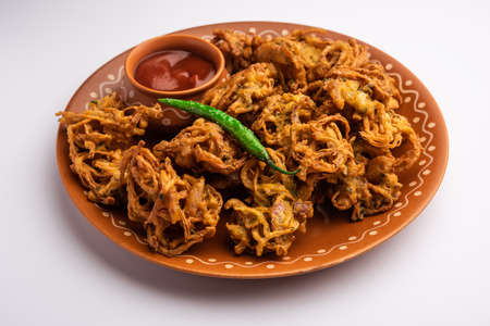 Crispy Kanda bhaji or Bhajji or Pyaj Pakode or fried onion pakora, delicious street food from Indiaの写真素材
