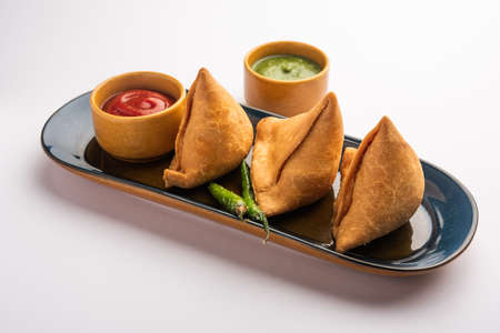 Veg Samosa - is a crispy and spicy Indian triangle shape snack which has crisp outer layer of maida...