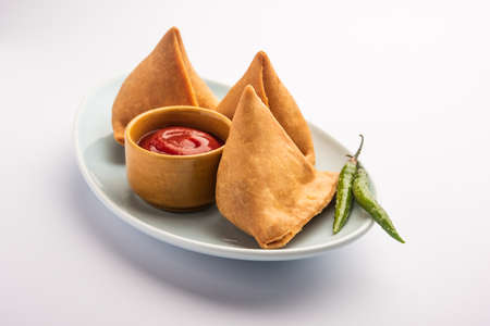 Veg Samosa - is a crispy and spicy Indian triangle shape snack which has crisp outer layer of maida...