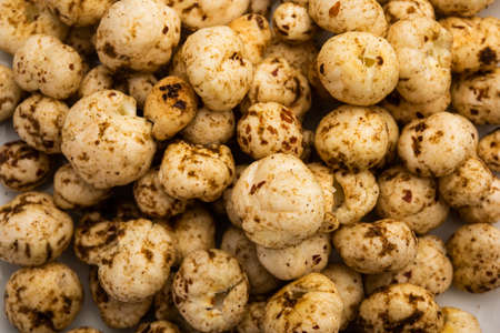 Roasted Phool Makhana or Crispy Masala  Lotus pops Seed served in a bowl, selective focus