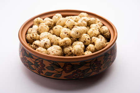 Roasted Phool Makhana or Crispy Masala  Lotus pops Seed served in a bowl, selective focus