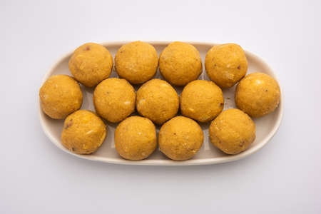 Besan ladoo are delicious sweet balls made with gram flour, sugar, ghee & cardamomsの写真素材