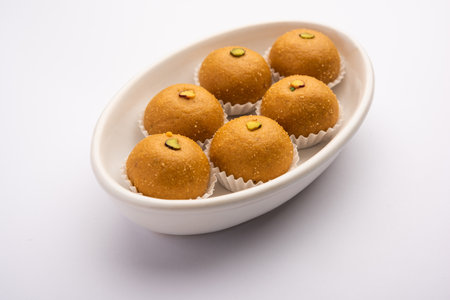 Besan ladoo are delicious sweet balls made with gram flour, sugar, ghee & cardamomsの写真素材