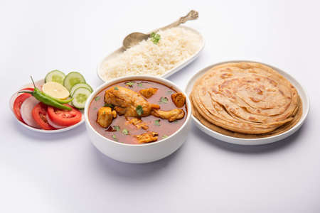 Traditional Indian Chicken Tikka Masala or curry served with Rice and laccha paratha or rotiの写真素材