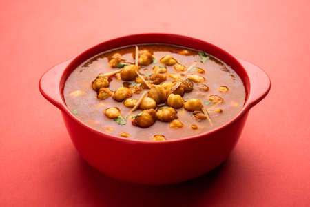 choley, chole masala or chana an indian food made of chickpeas, tomatoes and cumin served with...