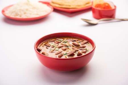 Rajma Curry or Rajmah Masala served with rice and laccha paratha