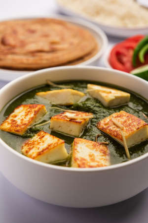 Palak paneer or Spinach and Cottage cheese curry served with rice and chapatiの写真素材