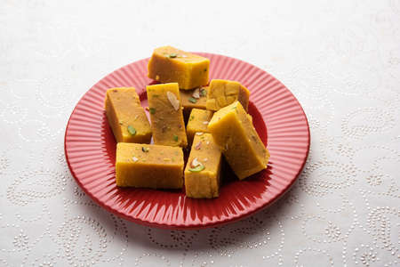 Mysore pak is an Indian sweet prepared in ghee. It originated in the city of Mysuru