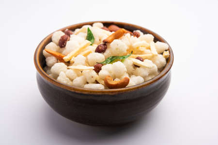 Sago or sabudana Chivda is Sweet and Spicy deep fried Farsan for upwas or vrat diet Or Fasting Food,...