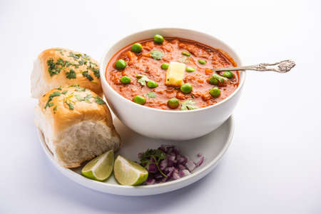 Pav bhaji is a fast food dish from India consisting of a thick vegetable curry served with a soft...