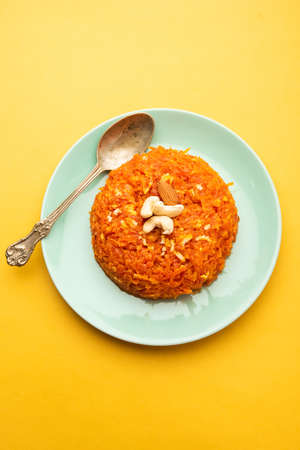 Gajar halwa, also known as gajorer halua, gajrela, gajar pak, and carrot halwa is a carrot-based sweet dessert pudding from the Indian subcontinentの写真素材