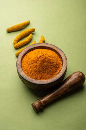 Dry Turmeric Dust or Haldi Powder also known as curcuma longa linn, selective focus