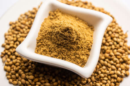Indian spice Heap of Coriander powder or Dhaniya Powder or Chinese parsley dried seeds, selective...
