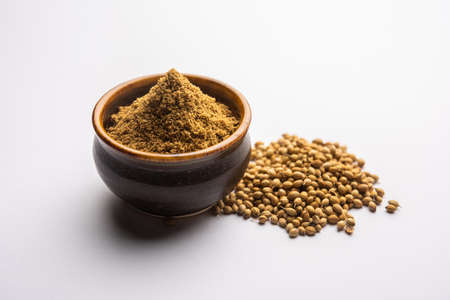 Indian spice Heap of Coriander powder or Dhaniya Powder or Chinese parsley dried seeds, selective...