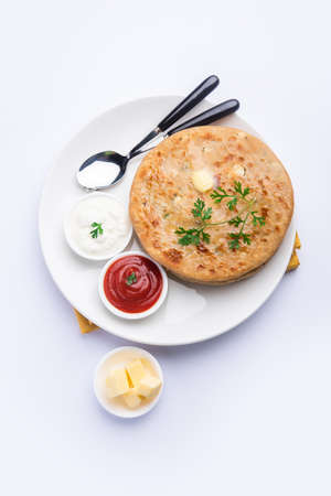 Aloo paratha or gobi paratha also known as Potato or Cauliflower stuffed flatbread dish originating from the Indian subcontinentの写真素材