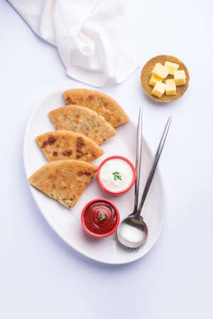 Aloo paratha or gobi paratha also known as Potato or Cauliflower stuffed flatbread dish originating...