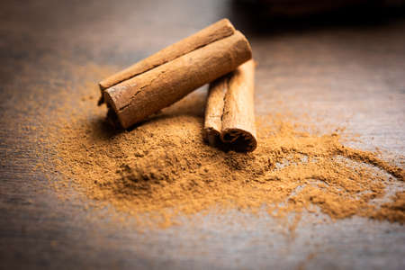 Cinnamon sticks and powder also known as Dalchini dust, Important ingradient from Indian spicesの写真素材