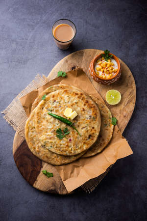 Paneer paratha is a popular North Indian flatbread made with whole wheat flour dough and stuffed with savory, spiced, grated paneerの写真素材