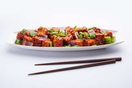 chilli paneer dry is made using cottage cheese, Indo chinese foodの写真素材